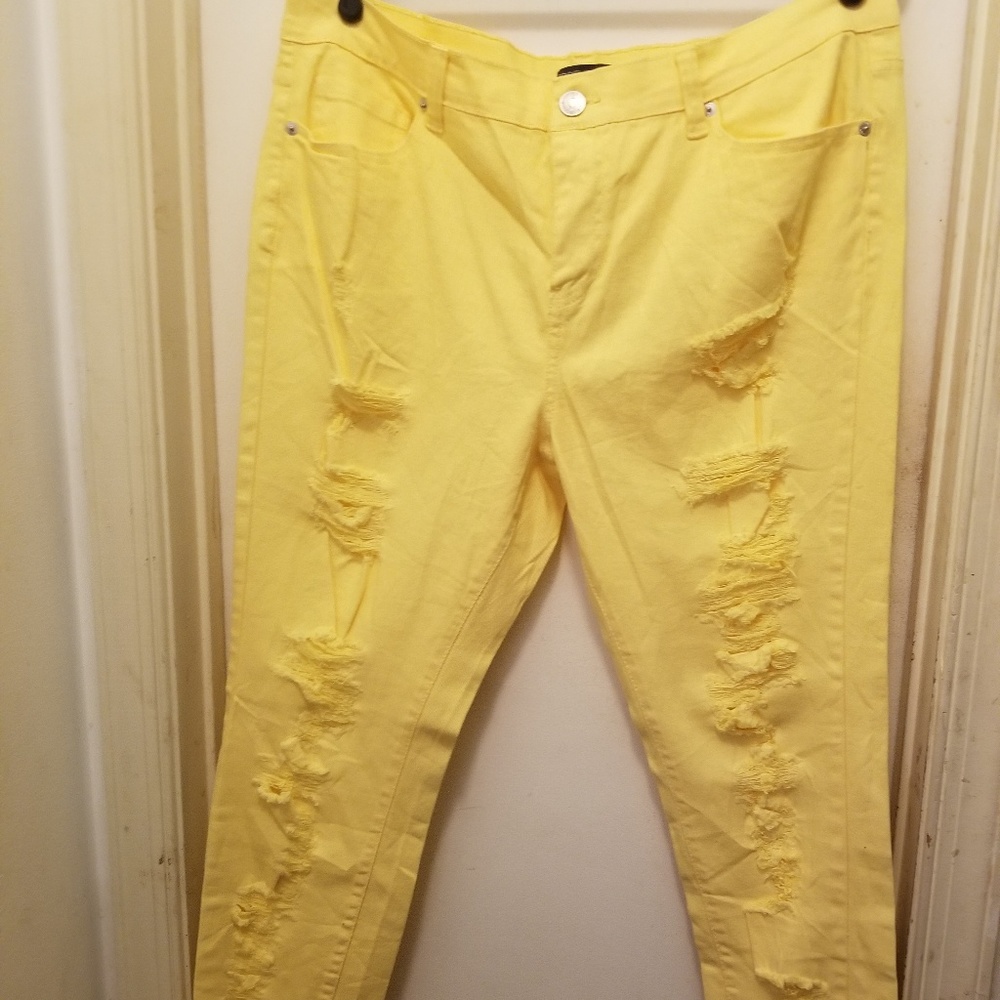 Yellow skinny distressed jeans